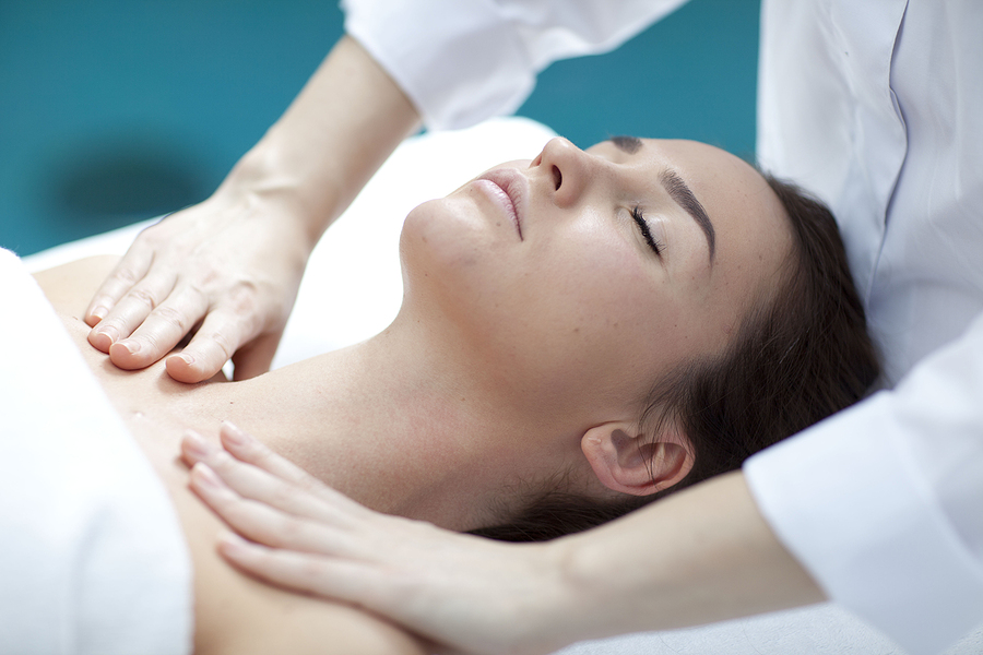 Young woman getting a massage in a spa Patient gets lymphatic drainage